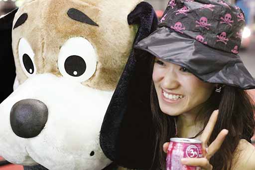 picture of a girl with a large, stuffed dog toy